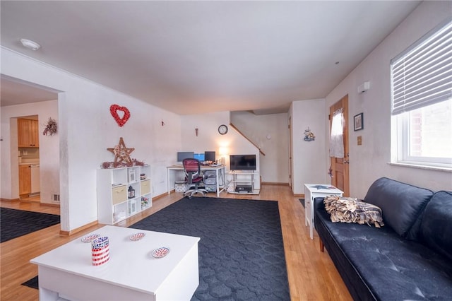 living room with light hardwood / wood-style floors