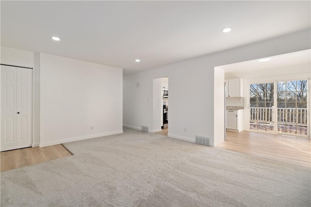 empty room with light colored carpet