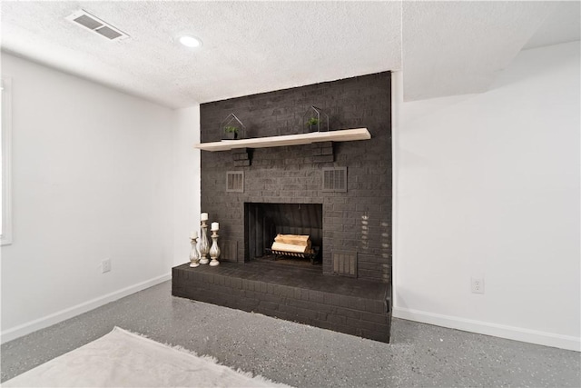 room details featuring a textured ceiling and a fireplace