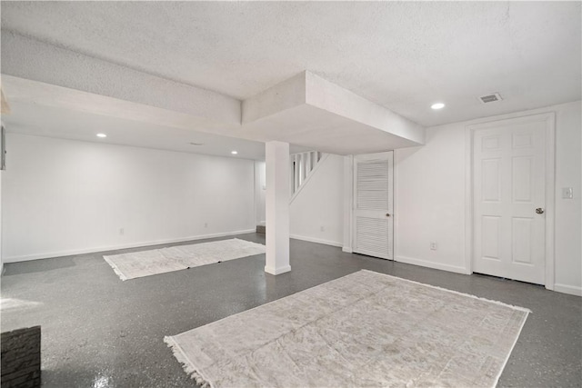 basement with a textured ceiling