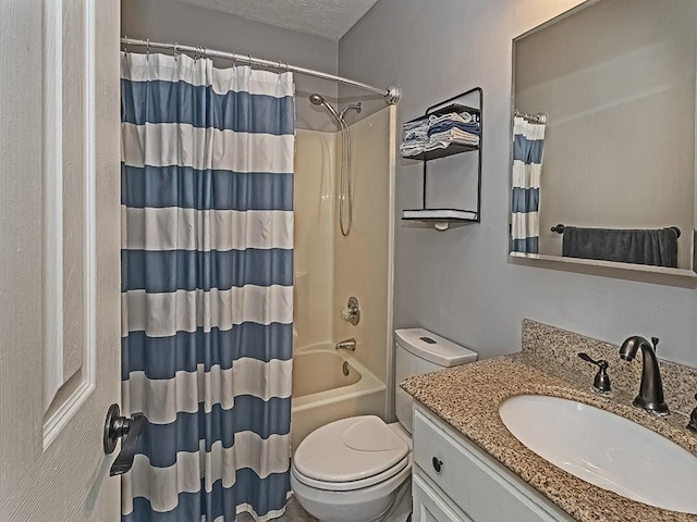 full bathroom featuring vanity, shower / bath combo, a textured ceiling, and toilet