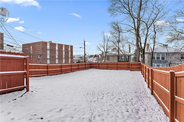 view of yard layered in snow