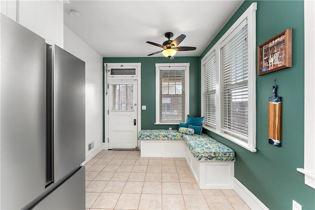 foyer entrance featuring ceiling fan and light tile patterned floors