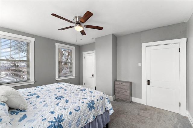 carpeted bedroom featuring ceiling fan