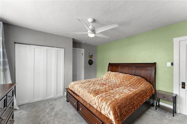 bedroom with ceiling fan and light colored carpet