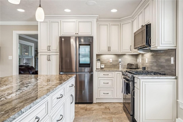 kitchen featuring white cabinets, appliances with stainless steel finishes, hanging light fixtures, ornamental molding, and light stone counters