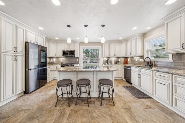 kitchen with tasteful backsplash, a kitchen island, decorative light fixtures, stainless steel appliances, and light stone counters