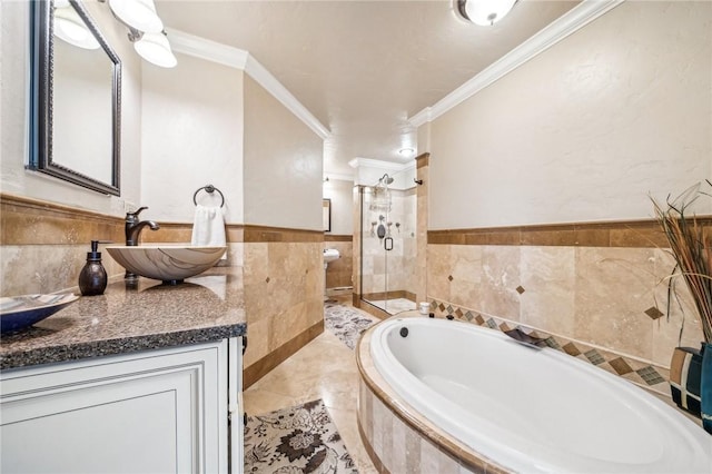 bathroom featuring vanity, independent shower and bath, and ornamental molding