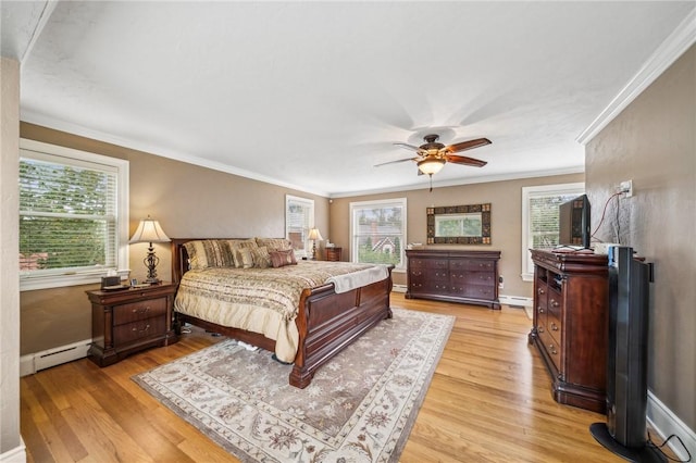 bedroom with ceiling fan, baseboard heating, light hardwood / wood-style flooring, and ornamental molding