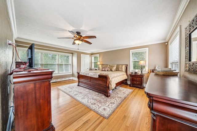 bedroom with light hardwood / wood-style floors, ceiling fan, ornamental molding, and a baseboard radiator