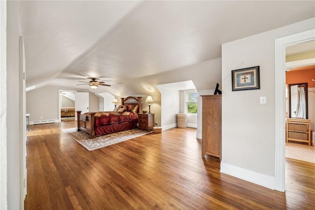 bedroom with ceiling fan, hardwood / wood-style floors, a baseboard radiator, and lofted ceiling