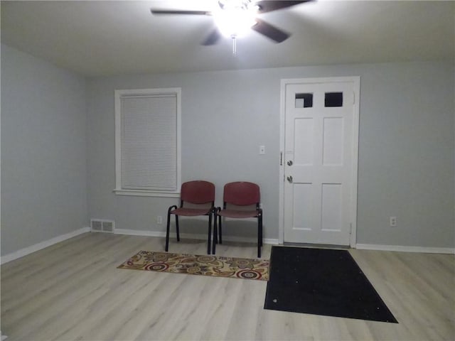 entrance foyer featuring ceiling fan and light hardwood / wood-style flooring