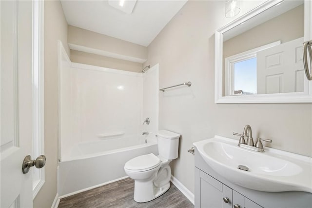 full bathroom with vanity, toilet, shower / tub combination, and hardwood / wood-style flooring