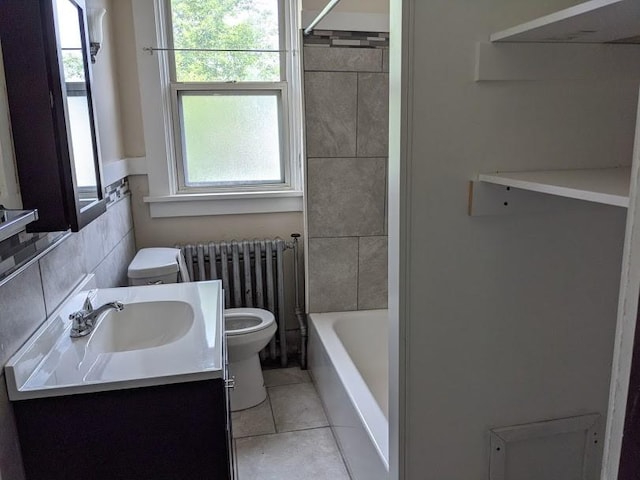 bathroom featuring toilet, radiator, tile patterned flooring, and vanity