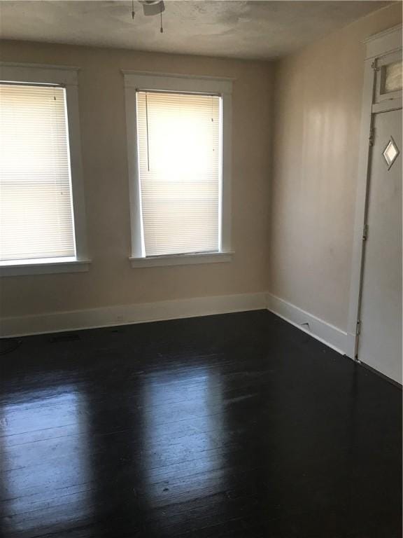 empty room featuring dark hardwood / wood-style floors