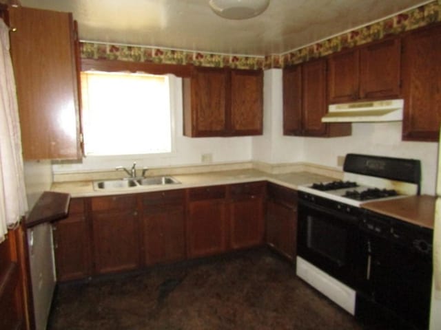 kitchen featuring white range with gas stovetop and sink