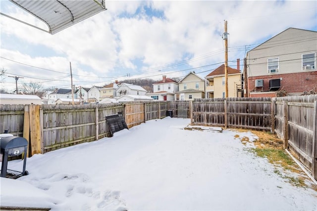 view of yard covered in snow