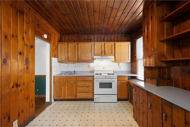 kitchen featuring white range with gas stovetop, sink, and wood ceiling