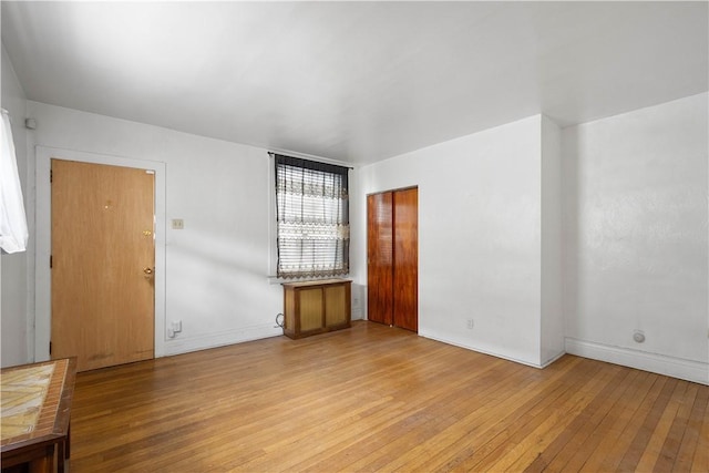 spare room featuring light hardwood / wood-style flooring