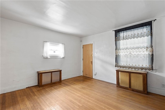 spare room featuring light hardwood / wood-style floors