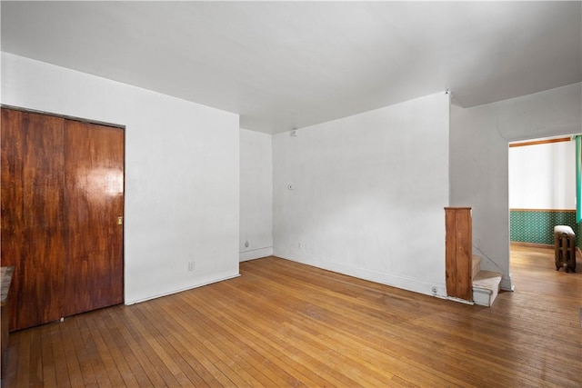 unfurnished room featuring hardwood / wood-style floors