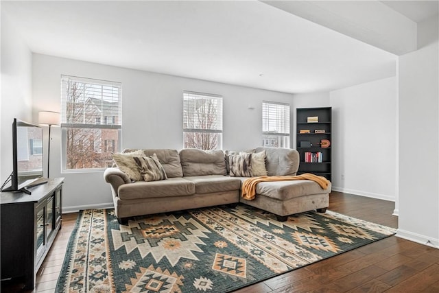 living room with dark hardwood / wood-style flooring