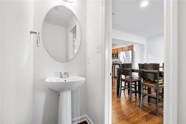 bathroom featuring hardwood / wood-style flooring and sink