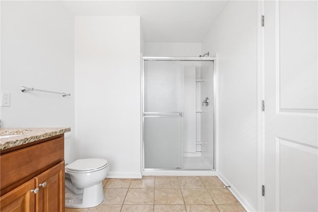 bathroom with toilet, tile patterned flooring, walk in shower, and vanity