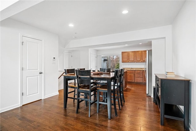 dining space with dark wood-type flooring