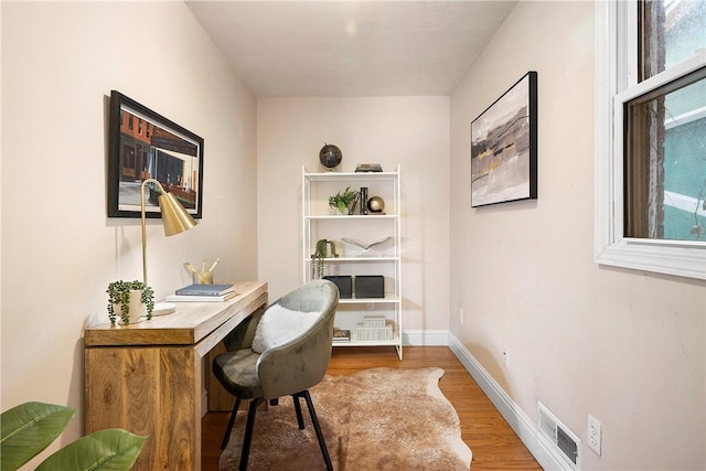 office with hardwood / wood-style flooring