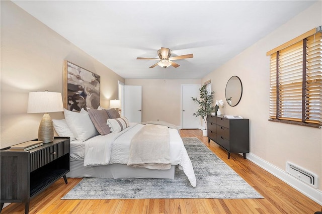 bedroom featuring light hardwood / wood-style flooring and ceiling fan