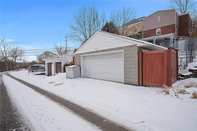 view of snow covered garage