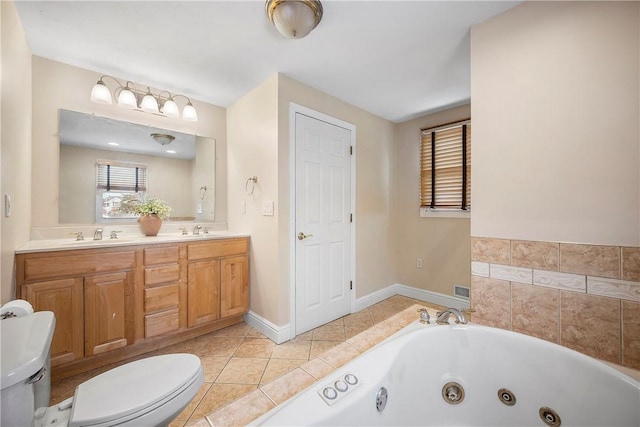 bathroom featuring toilet, tile patterned flooring, a bath, and vanity