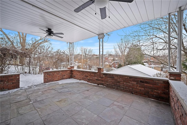 snow covered patio with ceiling fan