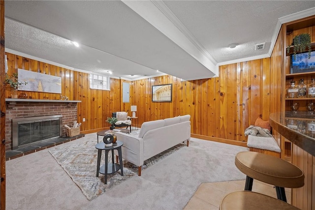 living room featuring light colored carpet, a textured ceiling, and crown molding