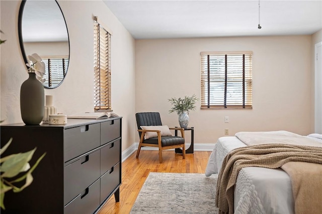 bedroom with light wood-type flooring