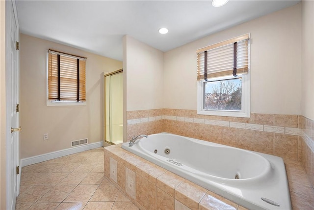 bathroom featuring independent shower and bath and tile patterned floors