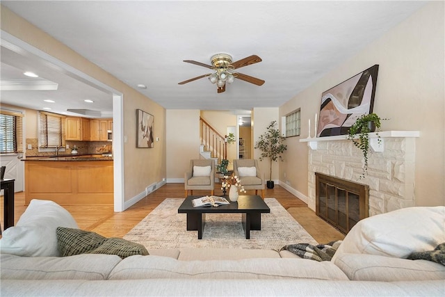 living room featuring light hardwood / wood-style flooring and a fireplace