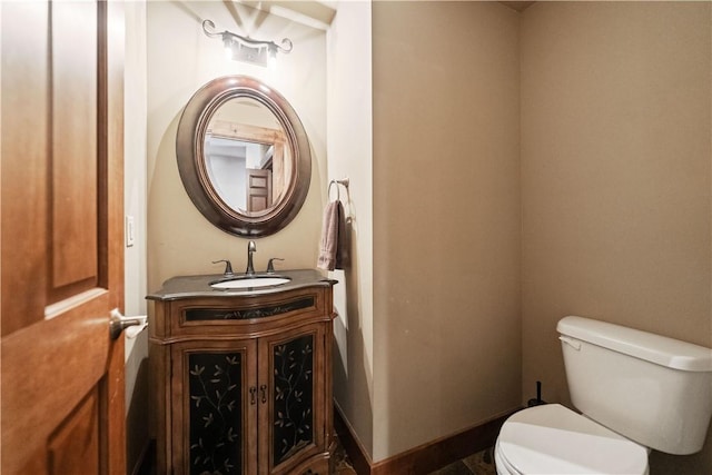 bathroom with toilet and vanity