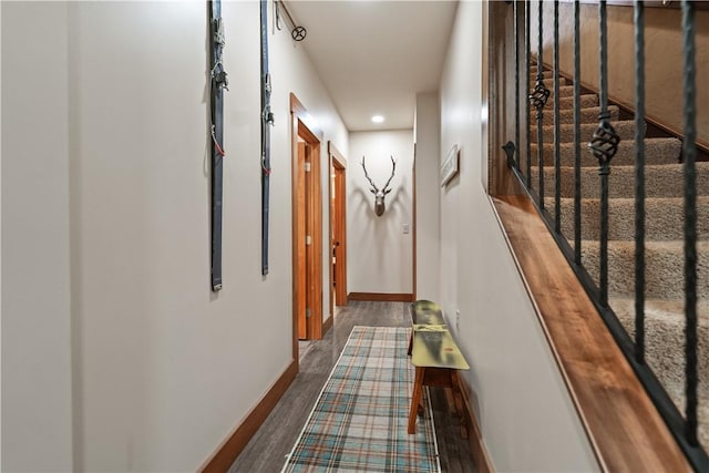 hallway with dark hardwood / wood-style flooring