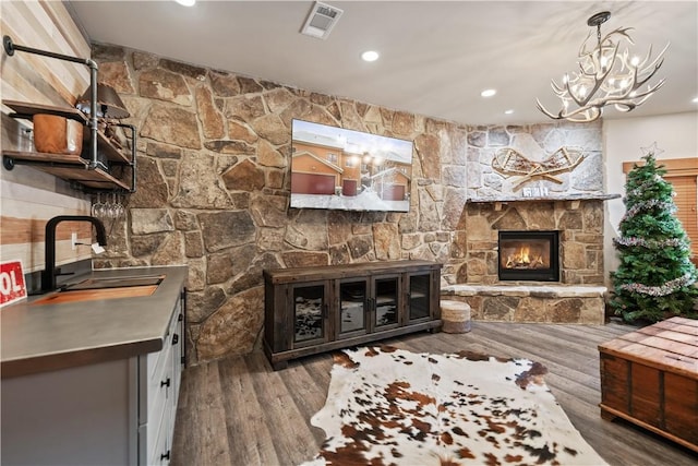 interior space with sink, hardwood / wood-style floors, and a fireplace