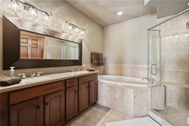 bathroom with tile patterned floors, vanity, and plus walk in shower