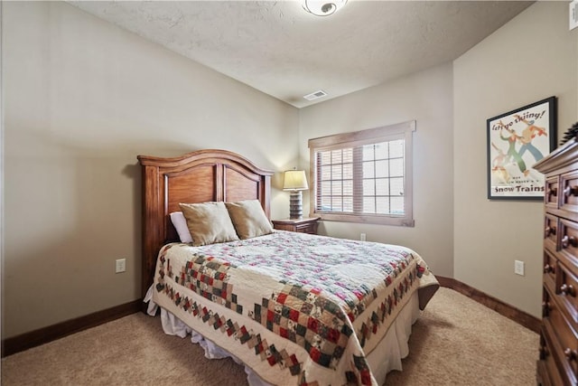 bedroom featuring light colored carpet