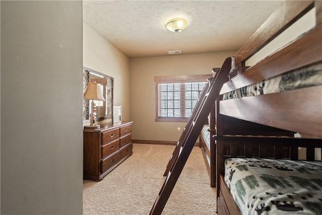 bedroom with light colored carpet