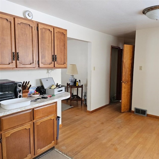 kitchen with light hardwood / wood-style floors