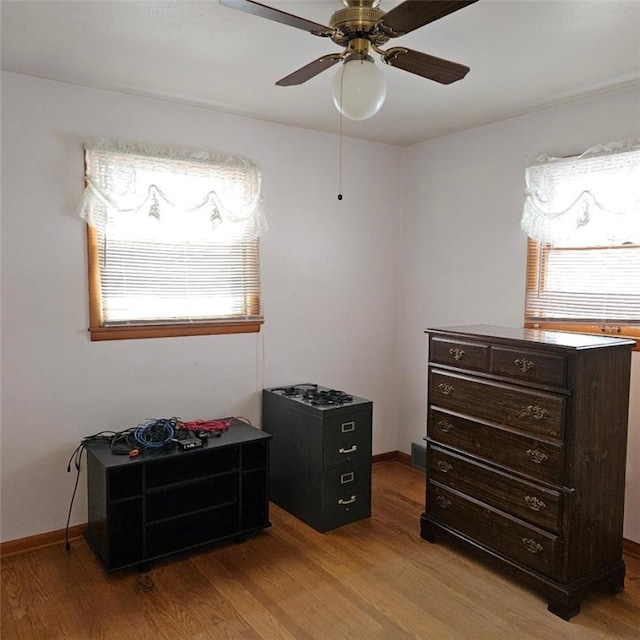 misc room featuring light wood-type flooring and ceiling fan