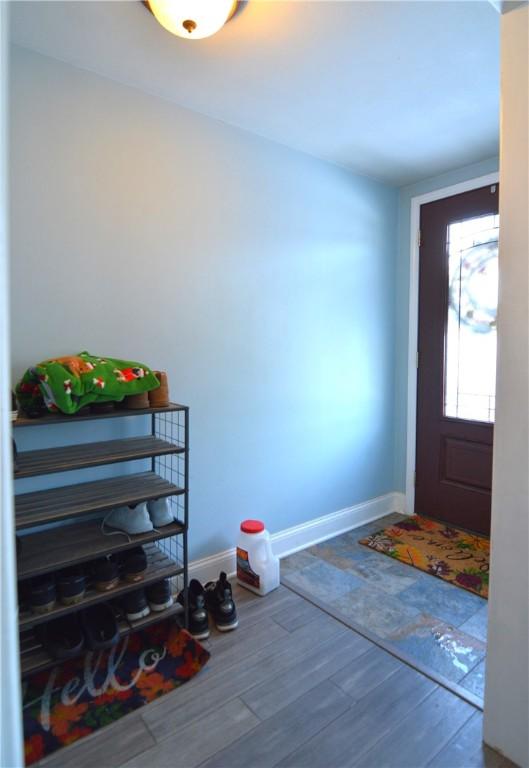 foyer entrance with hardwood / wood-style flooring