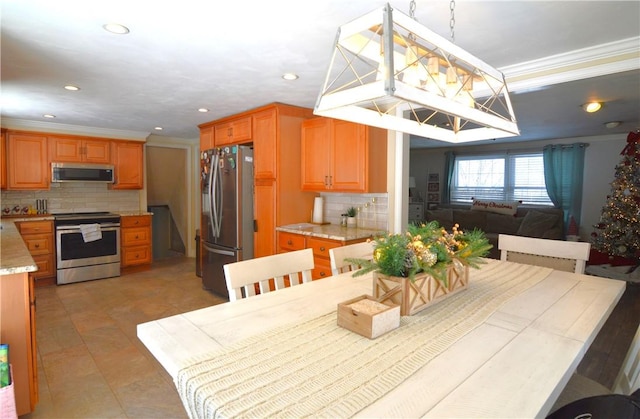 dining space featuring crown molding