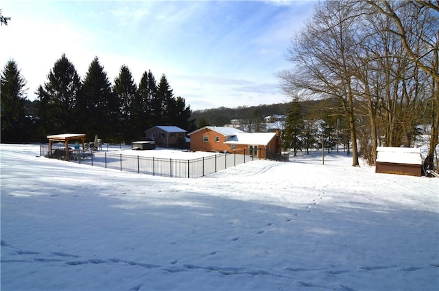 view of yard layered in snow