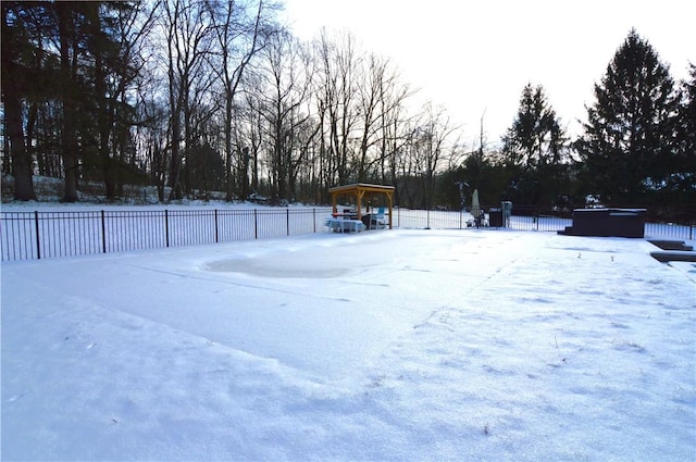 snowy yard with a jacuzzi